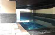 Swimming Pool 7 Pleasant 2BR at Tamansari La Grande Apartment By Travelio