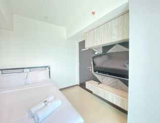 Bedroom 2 Pleasant 2BR at Tamansari La Grande Apartment By Travelio