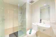 In-room Bathroom Pleasant 2BR at Tamansari La Grande Apartment By Travelio