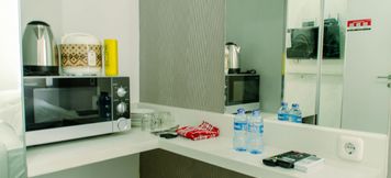 Common Space 3 Cozy Studio Apartment near CGK Airport at Aeropolis Residence By Travelio
