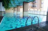 Kolam Renang 7 Comfy and Nice 2BR at Tamansari Panoramic Apartment By Travelio