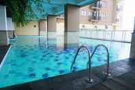 Swimming Pool Comfy and Nice 2BR at Tamansari Panoramic Apartment By Travelio