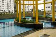 Swimming Pool Compact Studio Apartment at Bassura City By Travelio