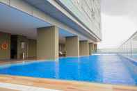 Swimming Pool Exquisite and Simply 1BR at Praxis Apartment By Travelio