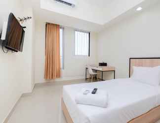 Bedroom 2 Cozy and Bright Studio at Evenciio Apartment near UI By Travelio