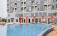 Swimming Pool 6 Cozy Living Studio at Amazana Serpong Apartment By Travelio