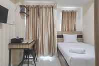 Kamar Tidur Comfort Studio Apartment at Vida View Makasar By Travelio