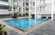 Swimming Pool 6 Delightful Luxurious Studio Room Apartment at Taman Melati Surabaya By Travelio
