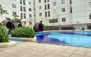 Swimming Pool 6 Cozy Living and Simple Studio Room at Bassura City Apartment By Travelio