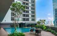 Swimming Pool 6 Minimalist and Homey 1BR Apartment at Ciputra World 2 By Travelio