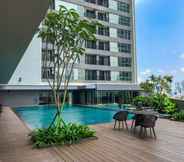 Swimming Pool 6 Minimalist and Homey 1BR Apartment at Ciputra World 2 By Travelio