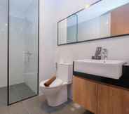 In-room Bathroom 5 Minimalist and Homey 1BR Apartment at Ciputra World 2 By Travelio