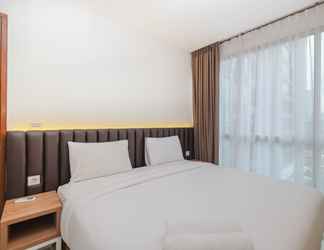 Bedroom 2 Minimalist and Homey 1BR Apartment at Ciputra World 2 By Travelio