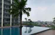 Swimming Pool 7 Comfort and Cozy Studio Apartment at Daan Mogot City By Travelio