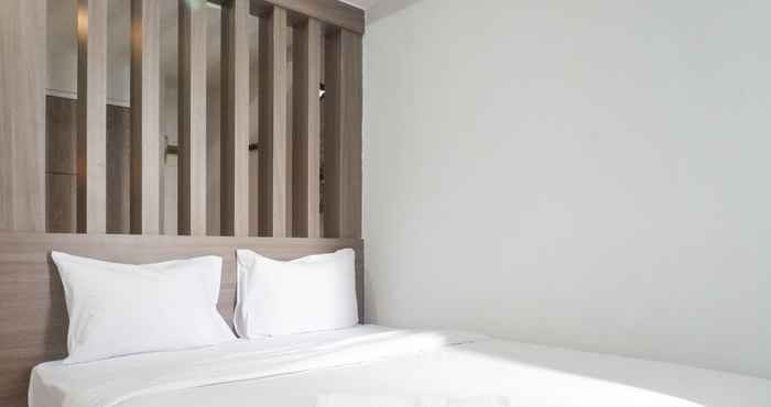 Bedroom Chic and Cozy Studio Room at Taman Melati Surabaya Apartment By Travelio