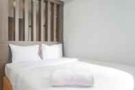 Bedroom Chic and Cozy Studio Room at Taman Melati Surabaya Apartment By Travelio