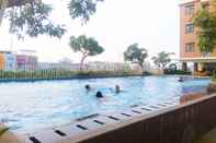 Swimming Pool Cozy Living and Comfortable 2BR at Lagoon Apartment By Travelio