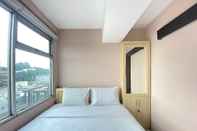 Bedroom Roomy 2BR at Jarrdin Cihampelas Apartment By Travelio