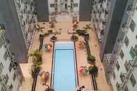 Bangunan Roomy 2BR at Jarrdin Cihampelas Apartment By Travelio