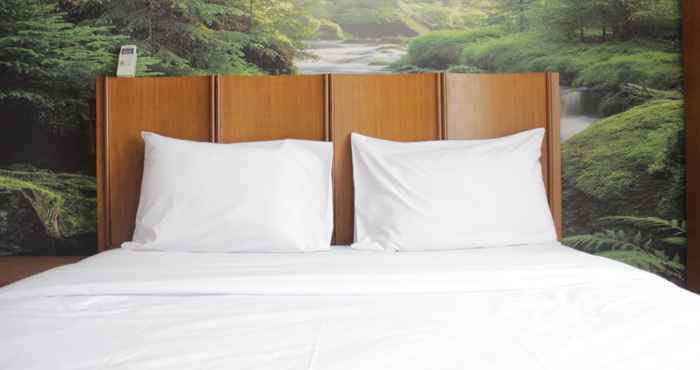 Bedroom Spacious 2BR at Grand Setiabudi Apartment By Travelio