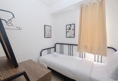 Bedroom 2 Comfy and Best Choice 3BR at Bassura City Apartment By Travelio