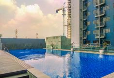 Swimming Pool 5 Comfort 1BR at Evenciio Margonda Apartment By Travelio