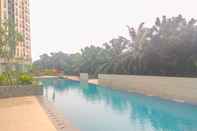 Swimming Pool Elegant and Comfy 3BR Apartment at Transpark Cibubur By Travelio