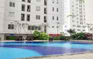 Swimming Pool 7 Comfortable 2BR at Bassura City Apartment By Travelio