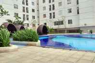 Swimming Pool Comfortable 2BR at Bassura City Apartment By Travelio