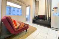 Lobby Bright & Stylish 1BR Apartment at Grand Asia Afrika Residence By Travelio