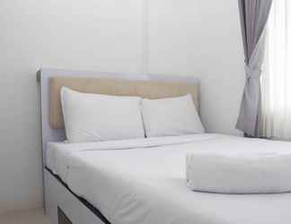 Bedroom 2 Comfort and Best Deal 2BR at Bassura City Apartment By Travelio
