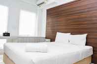 Kamar Tidur Cozy Living Studio near Bekasi Station at Patraland Urbano Apartment By Travelio