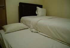 Kamar Tidur 3 Homey and Spacious 3BR at Kondominium Rajawali Apartment By Travelio