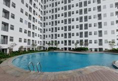 Swimming Pool 5 Minimalist and Comfy Studio Room at Serpong Garden Apartment By Travelio