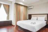 Kamar Tidur Comfort and Minimalist Studio at Tamansari The Hive Apartment By Travelio