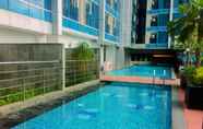 Swimming Pool 5 Comfort and Minimalist Studio at Tamansari The Hive Apartment By Travelio