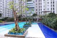 Swimming Pool Simply and Comfort 2BR at Green Bay Pluit Apartment By Travelio