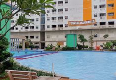 Swimming Pool 7 Tidy and Elegant 2BR Green Pramuka City Apartment near Mall By Travelio