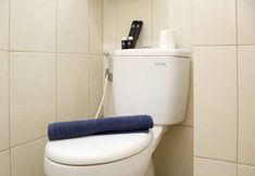 In-room Bathroom 5 Cozy and Nice Studio at Springlake Summarecon Bekasi Apartment By Travelio