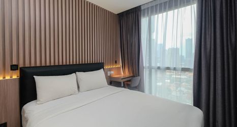 침실 2 Comfort and Elegant 1BR at Ciputra World 2 Apartment By Travelio Premium