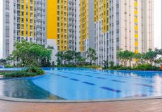 Swimming Pool 6 Nice and Cozy Studio at Springlake Summarecon Bekasi Apartment By Travelio