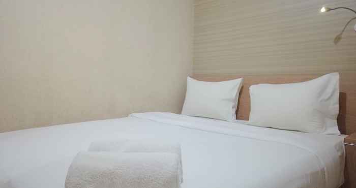 Kamar Tidur Combine and Minimalist 2BR at Green Pramuka City Apartment By Travelio