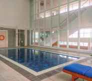 Swimming Pool 7 Comfortable and New Furnished 2BR at The Mayflower Apartment By Travelio