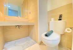 In-room Bathroom 4 Modern Studio Room Apartment with Jacuzzi at Art Deco By Travelio