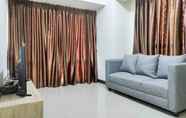 Lobby 3 Comfy and Big 3BR at Vida View Apartement By Travelio