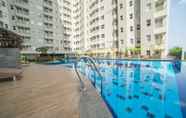 Swimming Pool 7 Cozy and Nice 2BR Apartment at Parahyangan Residence By Travelio