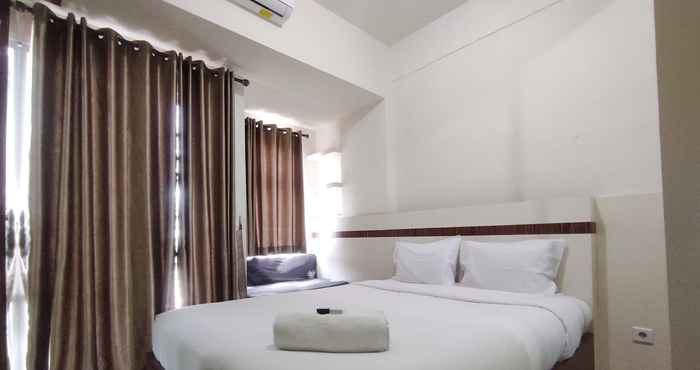 Kamar Tidur Convenient and Cozy Studio at Vida View Makassar By Travelio