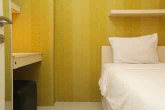 Bedroom 4 Warm and Minimalist 2BR Bassura City Apartment By Travelio