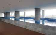 Swimming Pool 7 Cozy and Simple Living Studio Room at Poris 88 Apartment By Travelio
