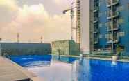 Swimming Pool 5 Tidy and Cozy Stay Studio at Evenciio Margonda Apartment By Travelio